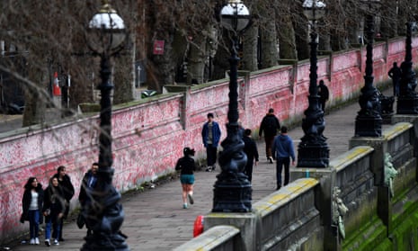 People walk past the National Covid Memorial Wall in London