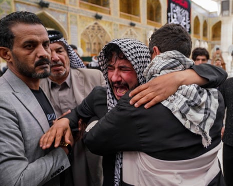Relatives grieve for an Iraqi soldier, who was killed in a strike at a military clinic in western Iraq’s Anbar province, during a procession in Najaf, Iraq