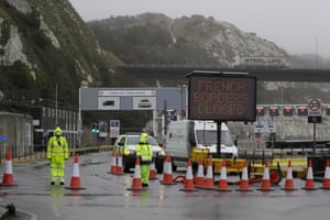 Security guards patrol the entrance to the ferry terminal at the port of Dover in England