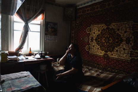 57-year-old Tatyana sits in her home as she describes her injuries following her dog stepping on a butterfly landmine which sent shrapnel into her own leg and killed the dog in Izyum, Ukraine.