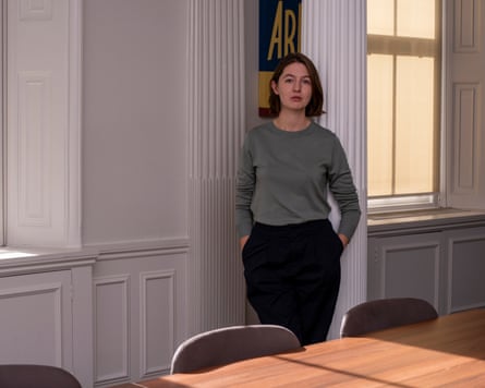 a woman standing next to a table
