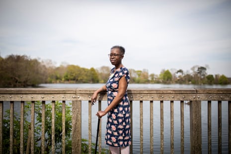 Miranda Ashitey, photographed by South Norwood Lakes, south London. She is leaning against a barrier with the lake in the background