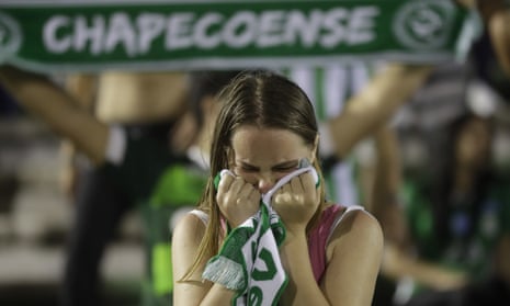 A fan of Brazil’s soccer team Chapecoense mourns during a gathering inside Arena Conda stadium in Chapecó.