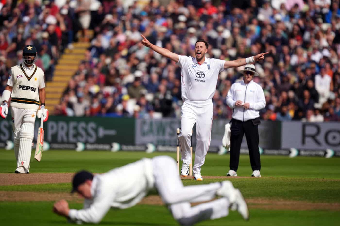 Ollie Robinson celebrates the wicket of Pakistan's Abdullah Shafique, caught out by Dan Lawrence.