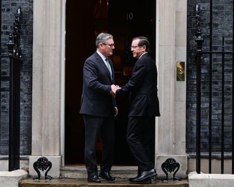 Herzog and Starmer shake hands as they prepare to enter Downing Street
