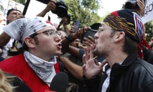 Two men arguing at the Boston rally.