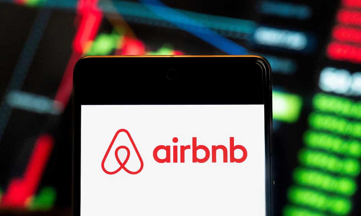 Phone screen showing AirBnb logo