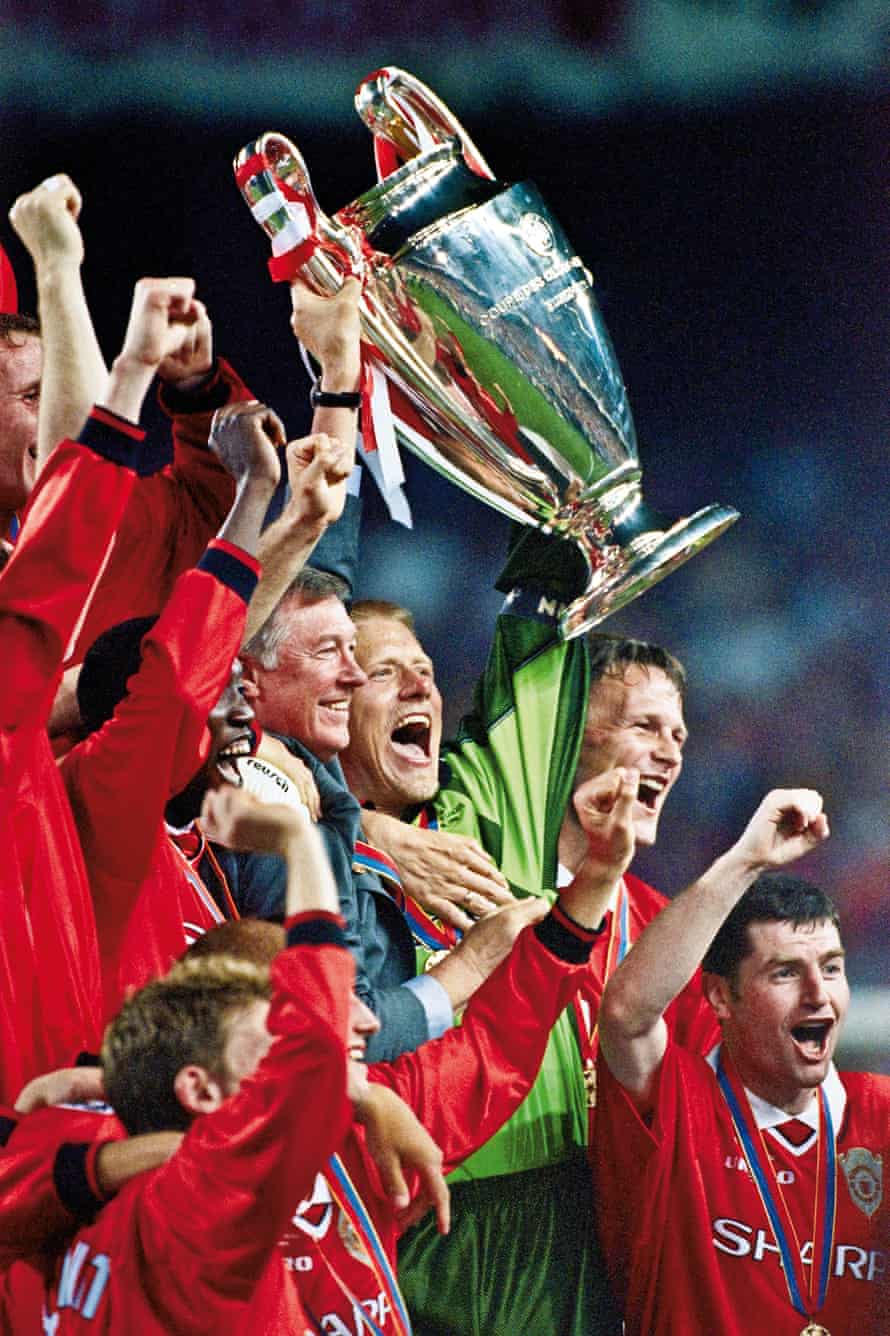 The Champions League trophy is raised aloft by Ferguson and goalkeeper Peter Schmeichel after Manchester United’s victory over Bayern Munich in the final in 1999
