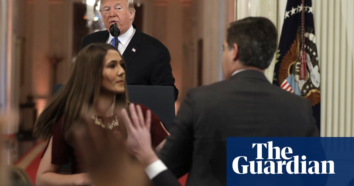 White House accuses CNN’s Jim Acosta of 'placing his hands’ on young intern – video