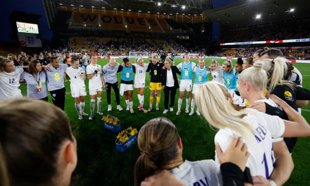 The England manager, Sarina Wiegman, speaks to her team after the final whistle of the friendly against Belgium at Molineux.