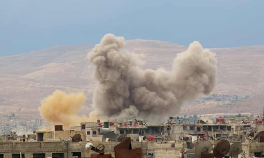Smoke rises from the Darayya suburb of eastern Damascus in October last year.