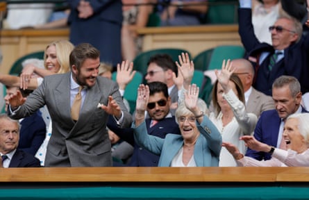 David Beckham joins in a Mexican wave, along with his mother, Sandra, and Dame Mary Berry (right)