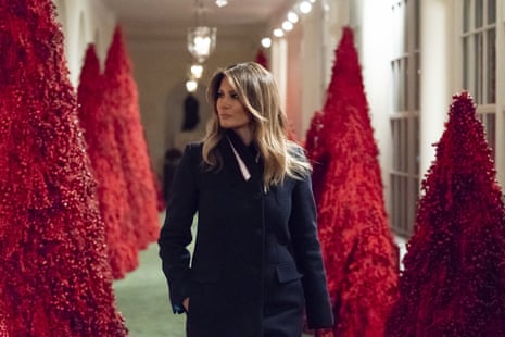Melania Trump reviewed blood-red trees along the East Colonnade as part of the 2018 White House Christmas decorations.