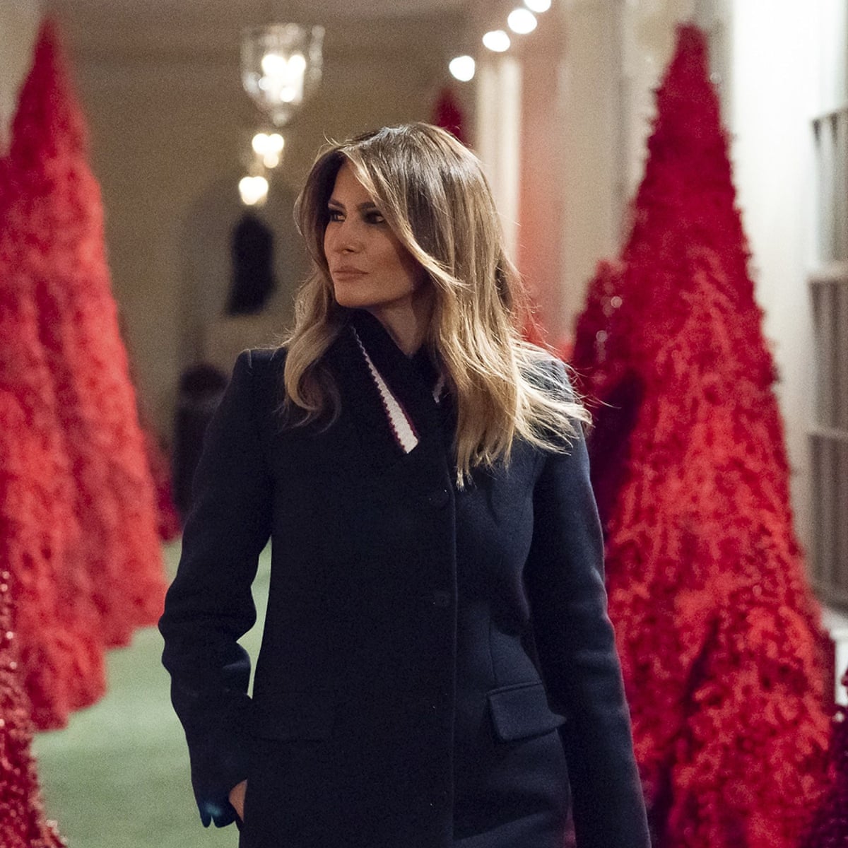 melania christmas dress First Lady Melania Trump is wearing a black Valentino wool dress with white embroidered sleeves, and black Christian Louboutin stilettos