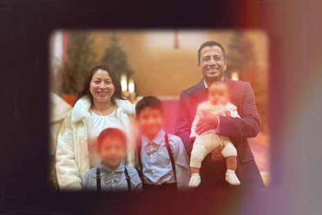 a family photo of a man, woman, two boys and a baby