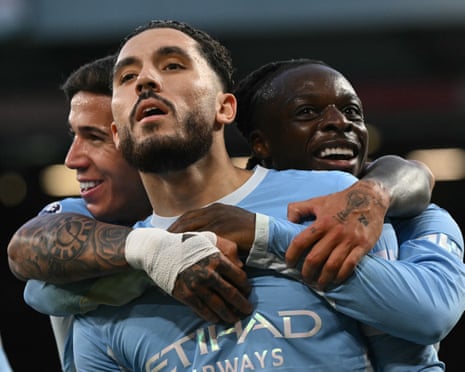 Rayan Cherki celebrates with Jérémy Doku and Enzo Fernández after scoring Manchester CityâÂÂs third goal against Liverpool.