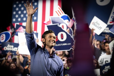 a man waves to supporters