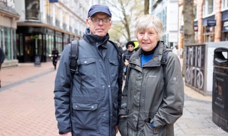 Close up of older couple standing in middle of a quiet city street
