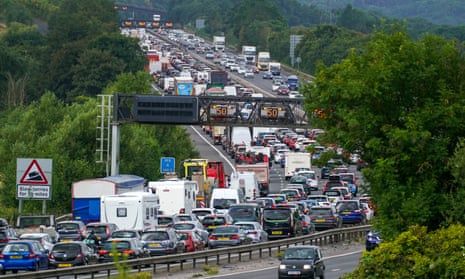 Vehicles queue on the M5 at the start of summer holidays for many schools in England and Wales.