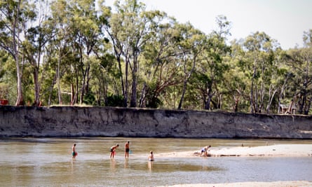 Children play in the Edward River at McLean Beach