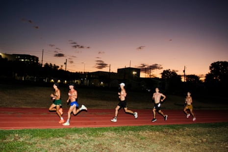 people run on track in dark