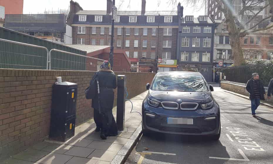 An electric car charging point blocks a pavement in London. 