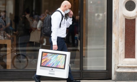 A shopper leaves the Apple store in Regent Street in London after the relaxation of Covid-19 lockdown rules.