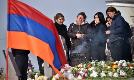 People visit the graves of their relatives killed during the Nagorno-Karabakh conflict