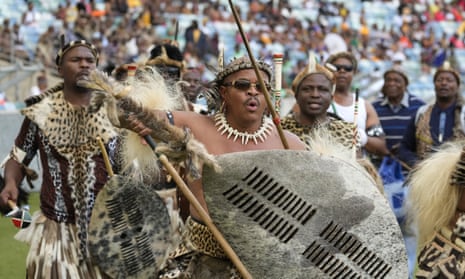 Zulu people sang and dance in traditional costume at Moses Mabhida stadium.