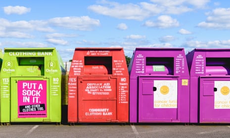 Clothes recycling bins at a car park.