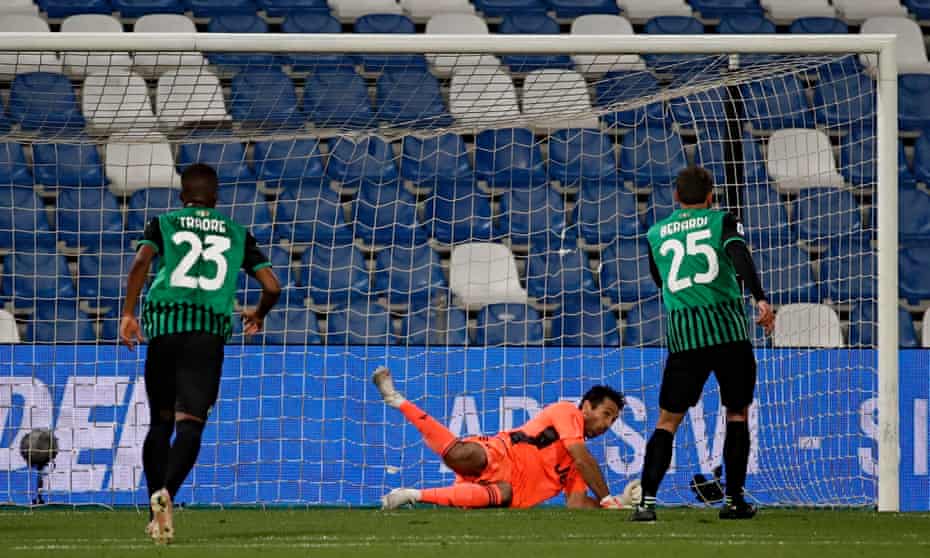 Gianluigi Buffon (centre) dives to his left to deny Sassuolo’s Domenico Berardi from the penalty spot.