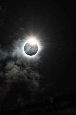 The Diamond Ring Melanie Thorne (UK) The dramatic moment that our star, the sun, appears to be cloaked in darkness by the moon during the Total Solar Eclipse of 9th March 2016 in Indonesia. The sun peers out from behind the moon and resembles the shape of a diamond ring, caused by the rugged edge of the moon allowing some beads of sunlight to shine through in certain places.