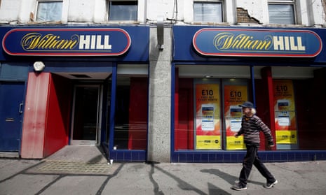 William Hill shop with pedestrian in front