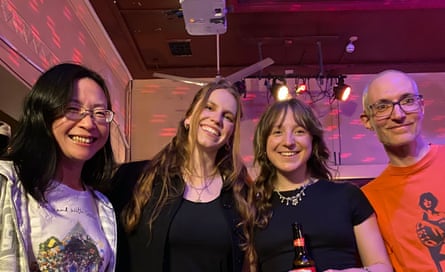 Mark Woollard (right) with his wife (left) and the band members of Prima Queen (middle).