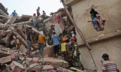 Rescue workers search for survivors after the collapse of the Rana Plaza factory complex.