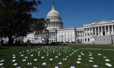 National Nurses United (NNU) displays white clogs outside the US Capitol to honor the nurses who have lost their lives to Covid-19, and to demand action from Congress.