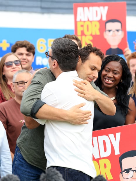 Burnham (in the white shirt) embracing Josh Simons, who gave up being MP for Makerfield to free up the seat for Burnham.