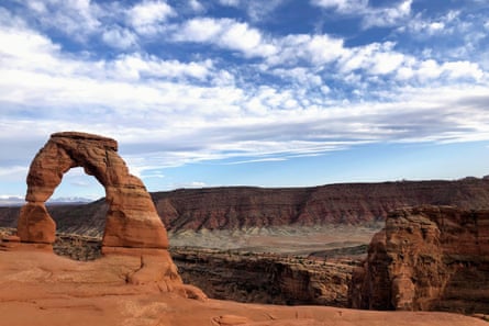 A stone arch above a canyon vista