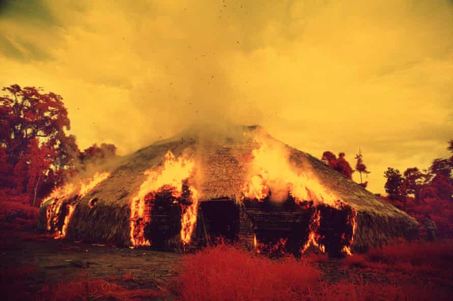 Catrimani, 1972-76, shot on infrared film. The Yanomami often burn down their yano, or collective house, when they migrate, when they want to escape from an epidemic, or when an important leader dies. Catrimani, 1972-76. Infrared film.