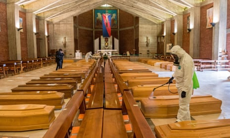 Army medical staff clears the coffins in the church of San Giuseppe in Seriate, Italy.