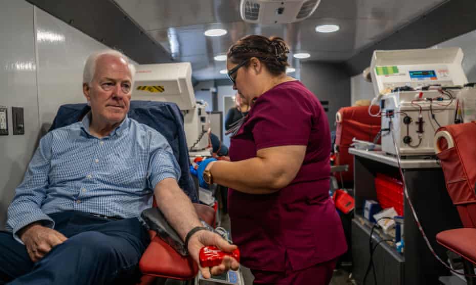 Senator John Cornyn prepares to donate blood in Uvalde in May, in the wake of the school shooting in the Texas city.