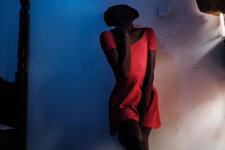 A member of Uganda’s transgender community poses for a photographer before attending events for a Transgender Day of Remembrance in Kampala, November, 2019.
