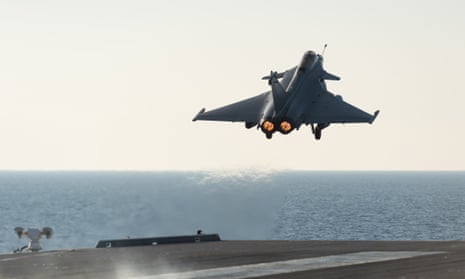 A French army Rafale fighter jet takes off from the aircraft carrier Charles de Gaulle, in the Mediterranean sea. 