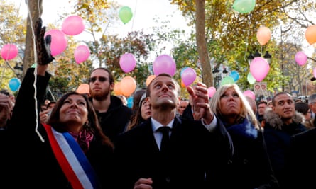 Anne Hidalgo, Emmanuel Macron and his wife, Brigitte, release balloons in Paris