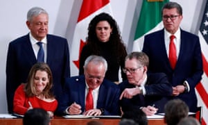 Mexico’s President Andrés Manuel López Obrador looks on as Chrystia Freeland for Canada, Jesús Seade for Mexico, and Robert Lighthizer for the US sign the trade pact at the presidential palace, in Mexico City on 10 December.