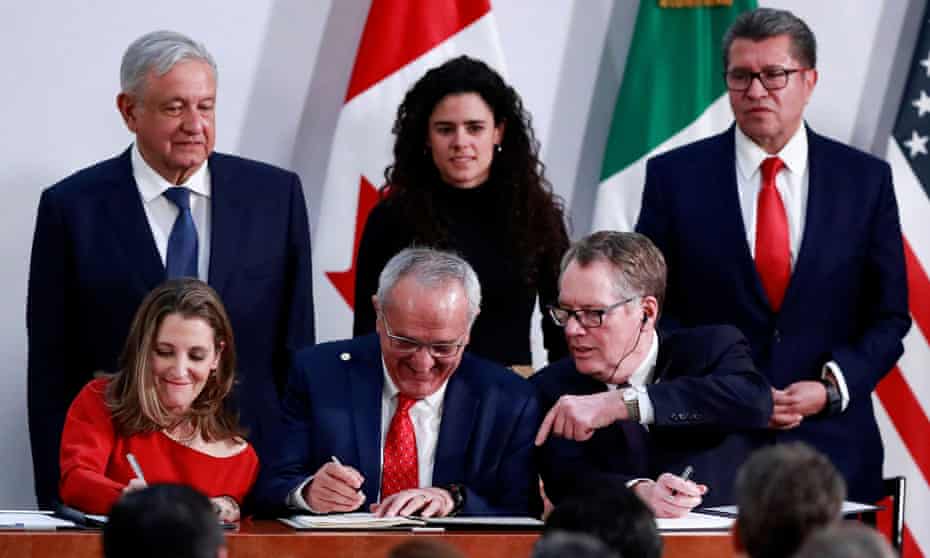 Mexico’s President Andrés Manuel López Obrador looks on as Chrystia Freeland for Canada, Jesús Seade for Mexico, and Robert Lighthizer for the US sign the trade pact at the presidential palace, in Mexico City on 10 December.