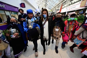 The Chilean environment minister and C0-25 president, Carolina Schmidt, centre, walks with delegates from indigenous communities during the Cop26 in Glasgow.
