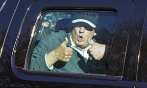 Donald Trump gives two thumbs up to supporters as he departs after playing golf at the Trump National Golf Club in Sterling, Virginia
