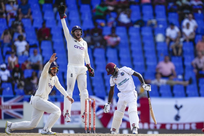 England’s Ollie Pope (left) and wicket keeper Ben Foakes successfully appeals for the wicket of West Indies’ Jermaine Blackwood.