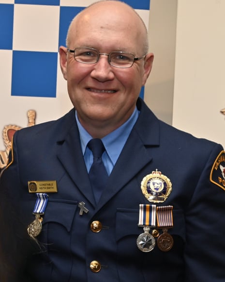 A police officer in a blue uniform.